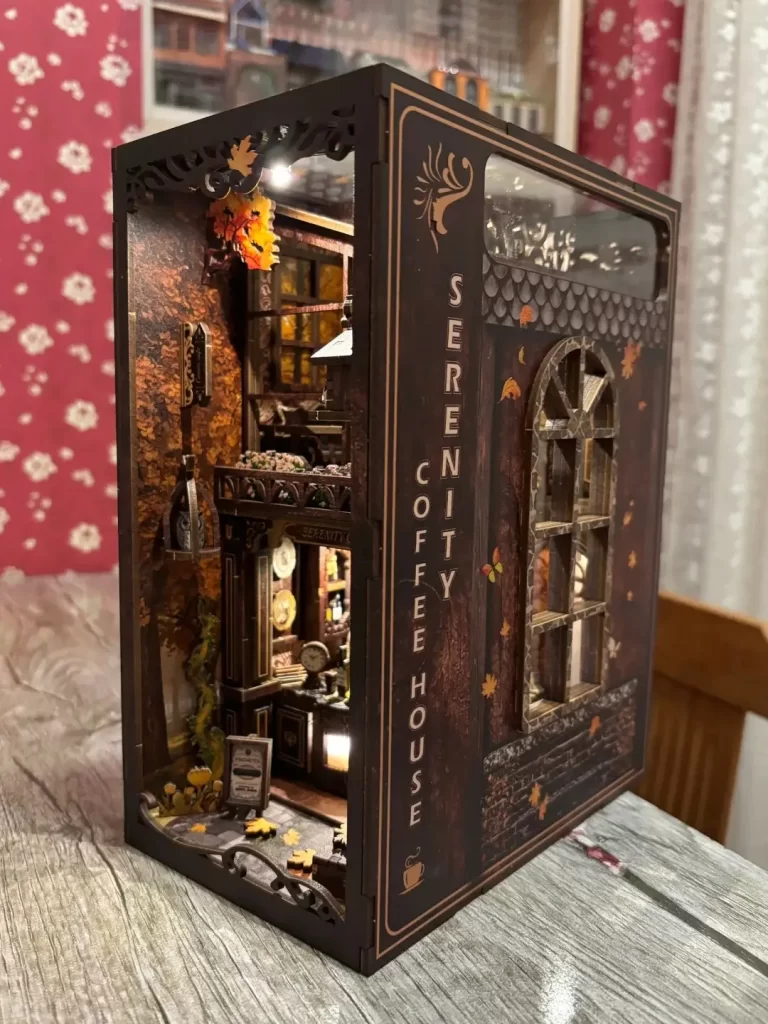 DIY book nook kit components with wooden panels, LED lights, battery box and accessories