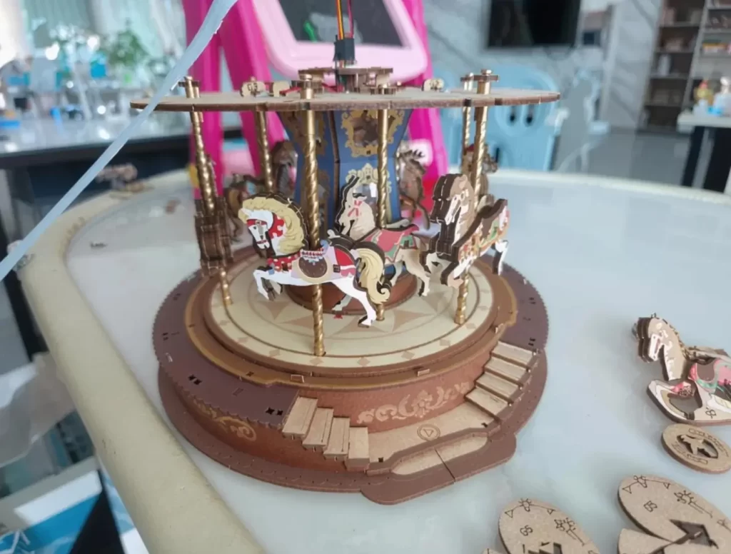 Gears and axles inside a mechanical 3D wooden puzzle